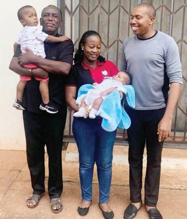 Dillibe Jnr. with dad, wife and children