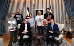 Elon Musk with Israeli President, Isaac Herzog and representatives of families of hostages held in Gaza during his visit to Israel, November 27, 2023. Photo Credit: Haim Zach/GPO